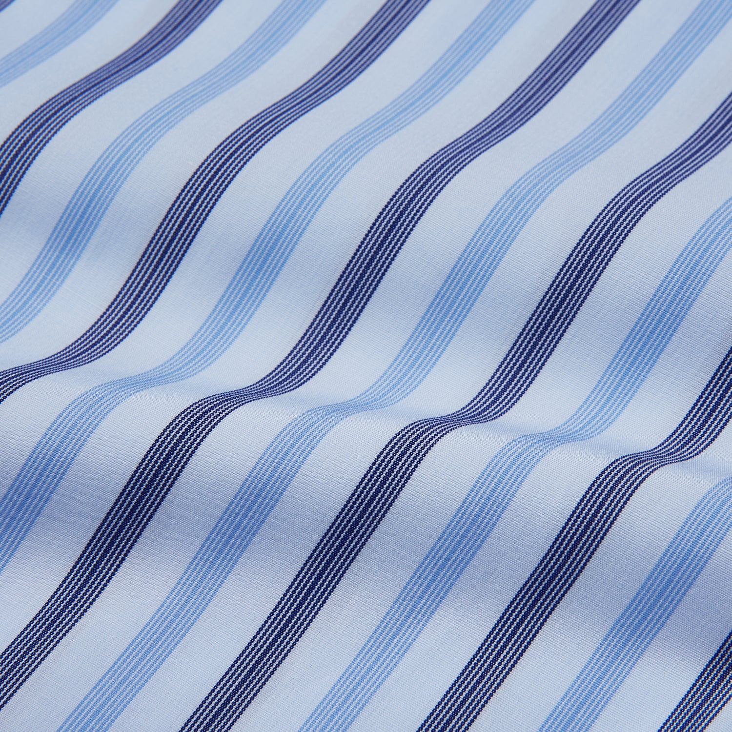 View 4 of product The Turnbull & Asser Pale Blue Multi Stripe Cotton Regular Fit Whitby Shirt, with collar and cuffs, is shown laid flat on a white background.