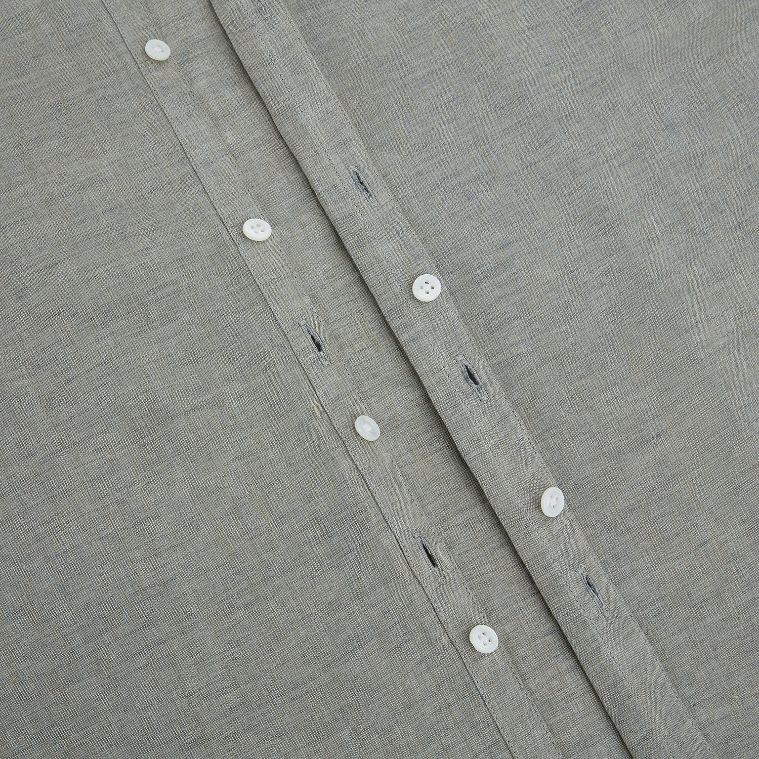 View 7 of product The Flint Grey Linen Westminster Shirt by Turnbull & Asser features long sleeves, a pointed Westminster collar, white buttons, and fine British craftsmanship, shown on a plain white background.