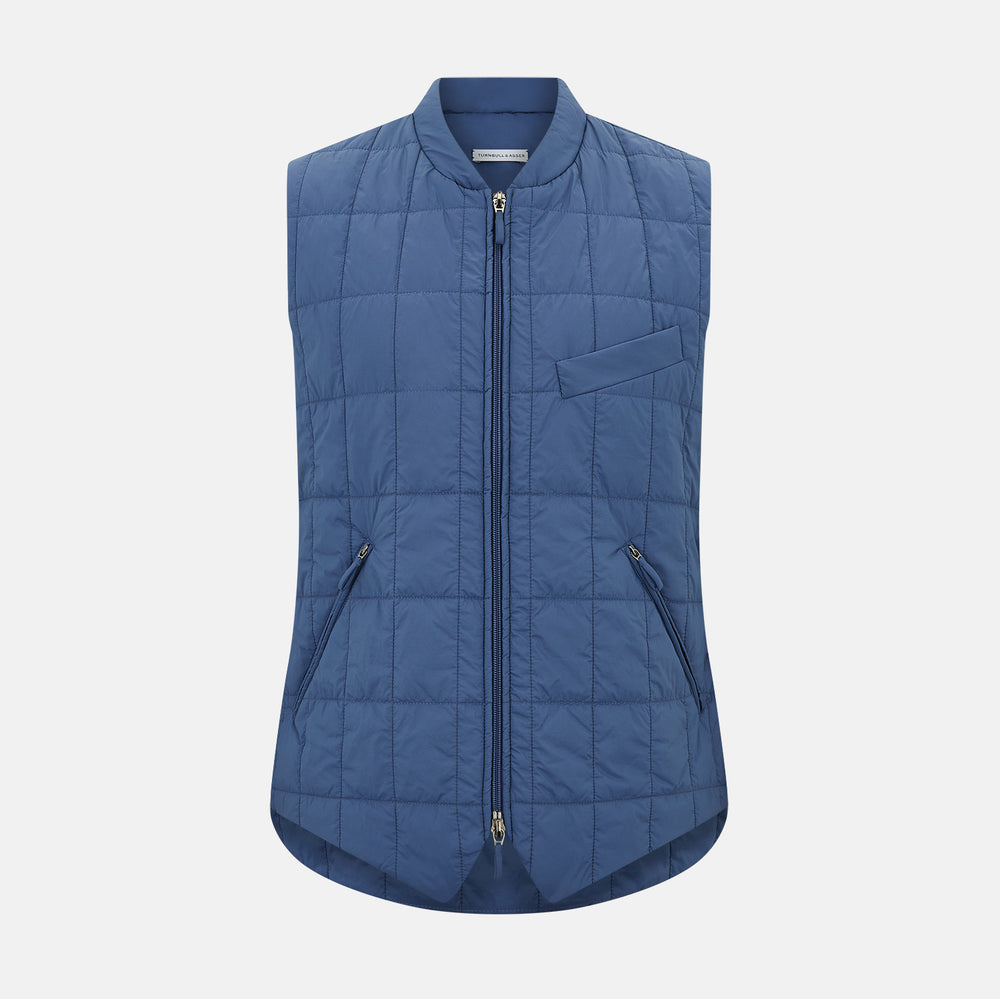 The Azzurro Quilted Gilet by Turnbull & Asser is a sleeveless, lightweight men’s outerwear piece featuring a front zipper, angled zippered pockets, and a chest pocket, shown against a plain white background.
