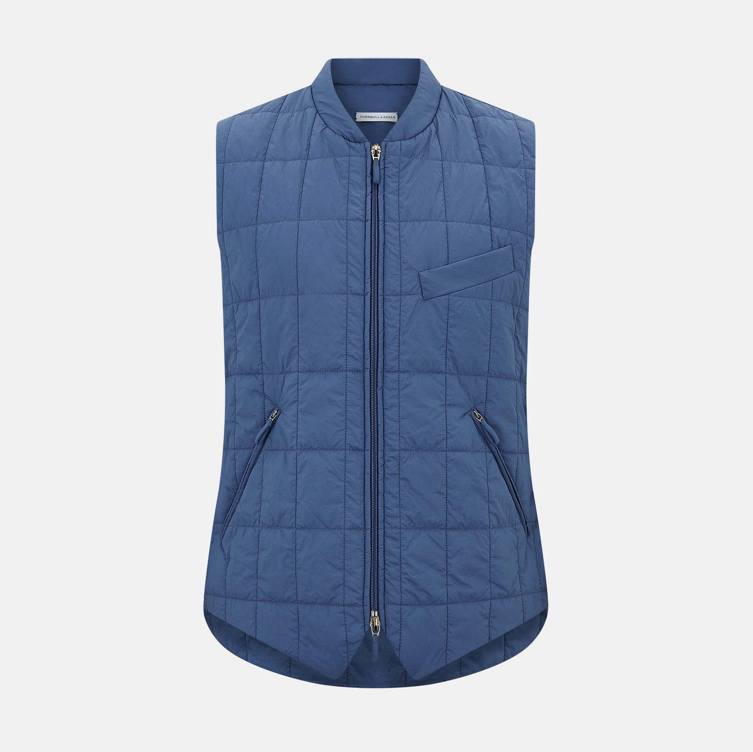View 1 of product The Azzurro Quilted Gilet by Turnbull & Asser is a sleeveless, lightweight men’s outerwear piece featuring a front zipper, angled zippered pockets, and a chest pocket, shown against a plain white background.