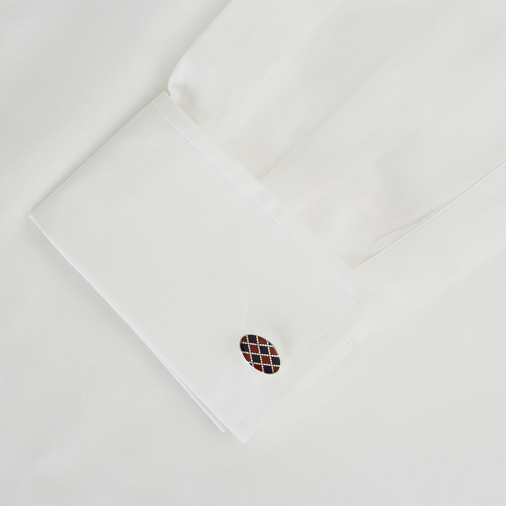 Displayed on a white background, the Turnbull & Asser Burgundy and Navy Checkered Oval Enamel Cufflinks capture masculine elegance with their geometric enamel design.