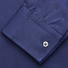 View 4 of product The Blue Piece Dyed Weekend Fit Suffolk Shirt by Turnbull & Asser features a button-down Dorset collar, chest pocket, white buttons, and long sleeves in classic navy, laid flat against a white background.