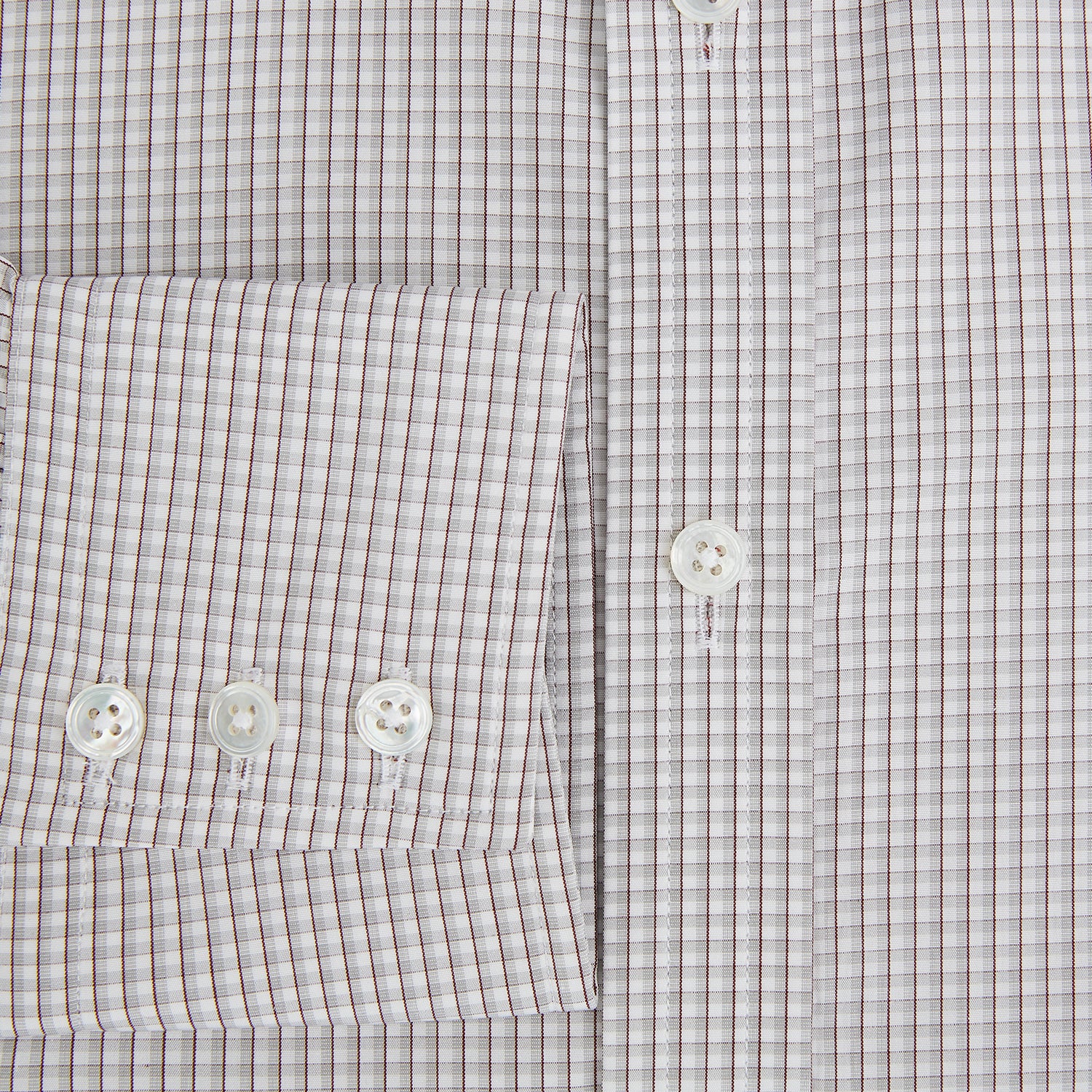 View 4 of product The Turnbull & Asser Grey Micro Shadow Check Mayfair Shirt is crafted from premium Italian cotton with long sleeves, a collar, and buttoned cuffs, shown folded flat against a white background.