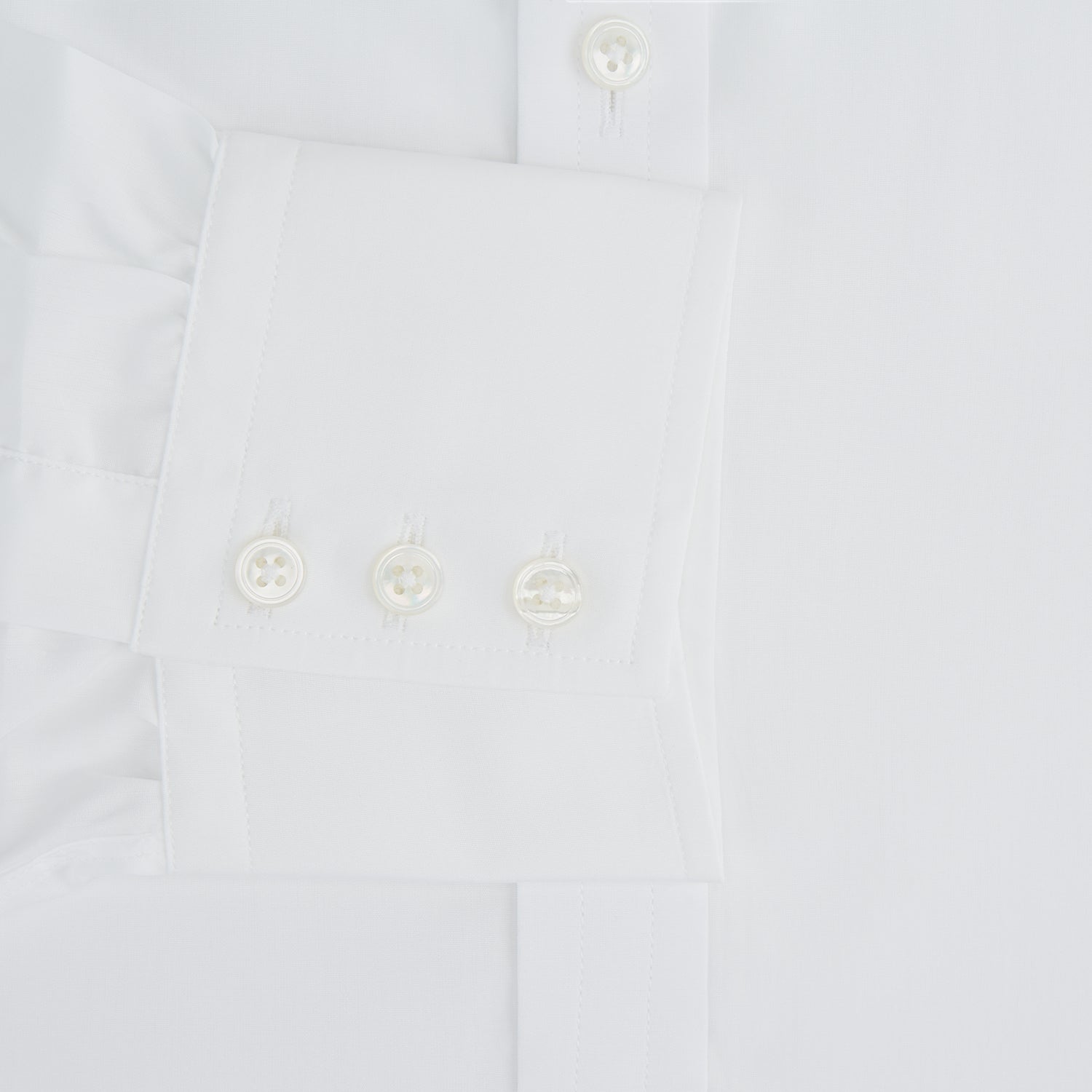 View 3 of product The Turnbull & Asser White Sea Island Quality Cotton Shirt features a T&A collar and 3-button cuffs, crafted from premium cotton and showcased against a plain white background.