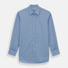 View 1 of product The Turnbull & Asser Blue Cotton Shirt features a T&A collar, double cuffs, and white buttons. This classic formal shirt is perfect for any gentleman and pairs effortlessly with a navy suit. Displayed on a plain white background.