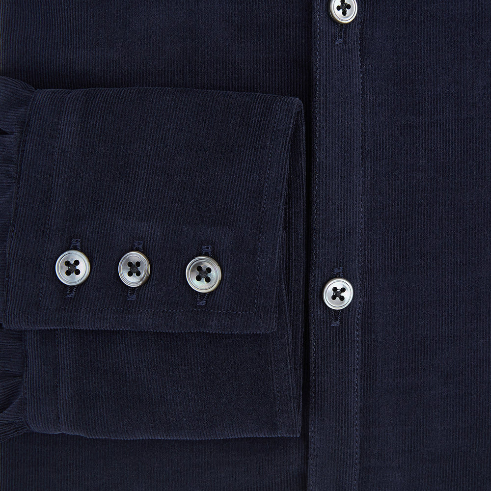 A navy corduroy Windsor shirt by Turnbull & Asser, featuring British craftsmanship and a classic collar, displayed on a plain white background.