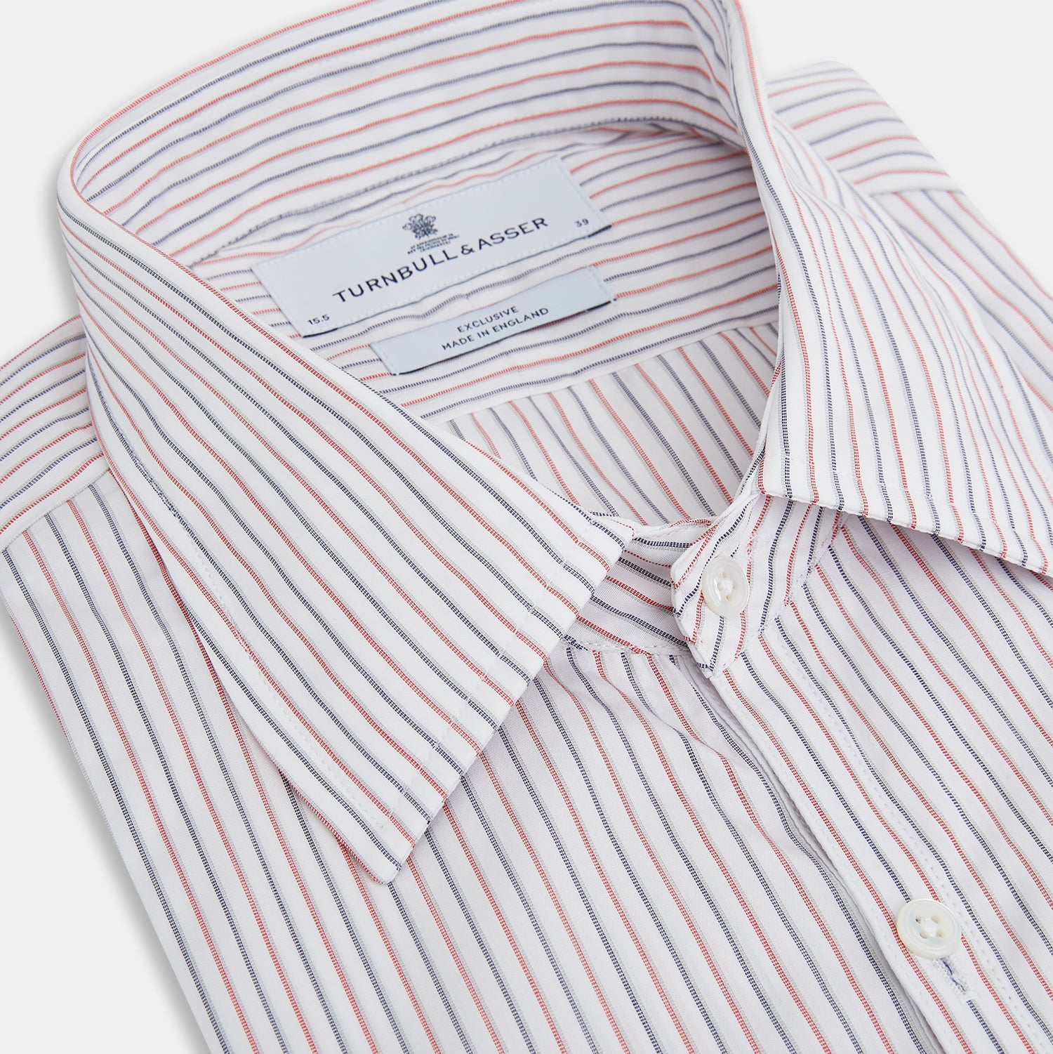 View 2 of product The Turnbull & Asser Red and Blue Double Stripe Westminster Shirt is a long-sleeved, button-up dress shirt with a formal collar, featuring narrow red and blue stripes on white, shown against a plain white background.