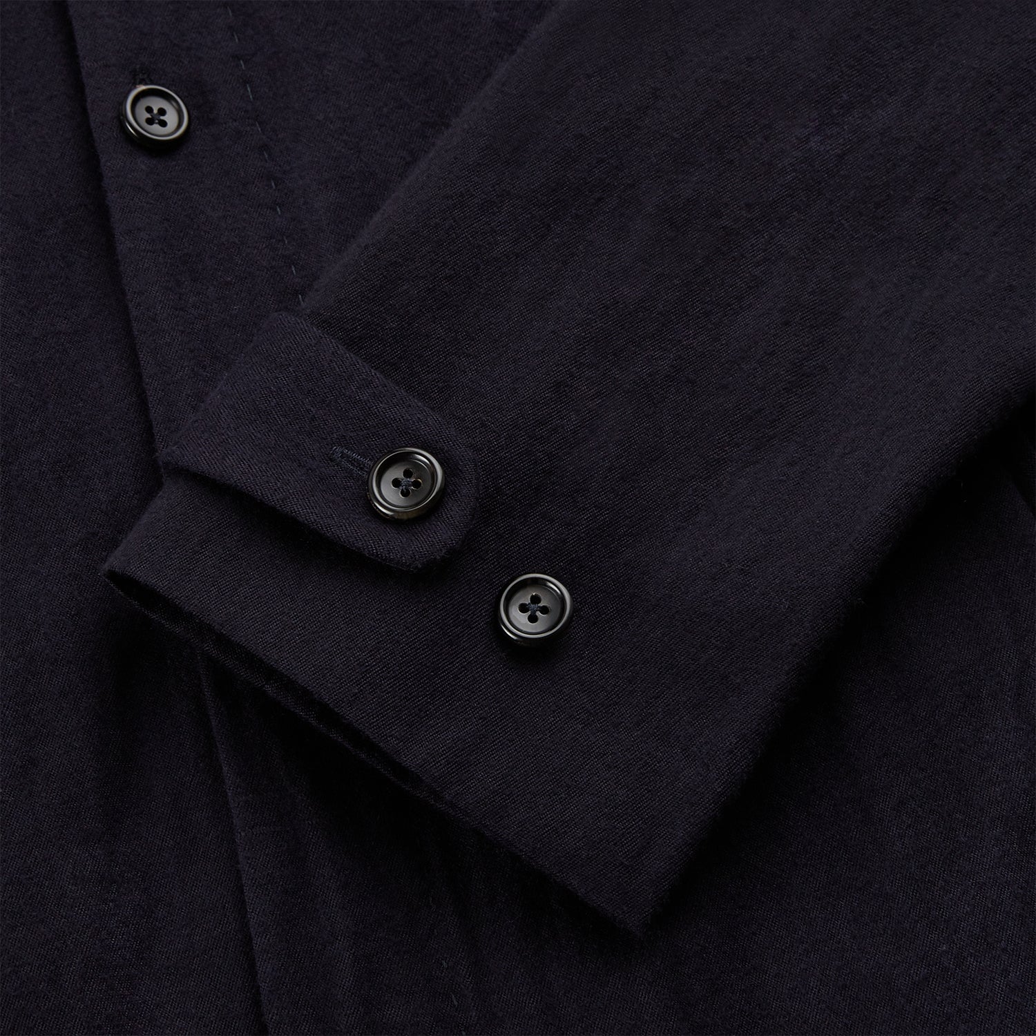 View 4 of product A navy button-up Primrose overshirt by Turnbull & Asser with a classic collar, two side pockets, a left chest pocket, and buttoned cuffs—an ideal blazer alternative, shown on a plain white background.