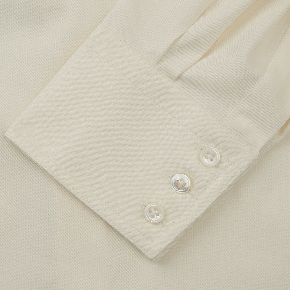 The Cream Cotton Weekend Fit Western Shirt with Dorset Collar by Turnbull & Asser features two chest pockets and is laid flat on a white background—ideal for smart-casual style.