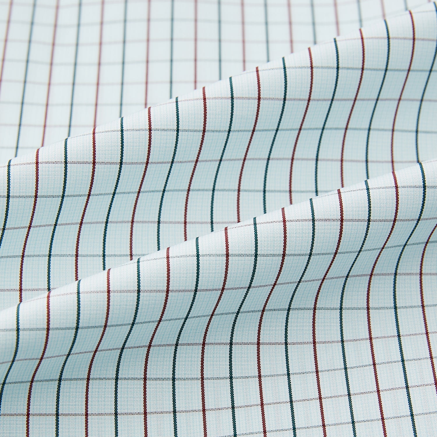 View 8 of product The Turnbull & Asser Forest Melange and Red Overlay Grid Check Westminster Shirt features long sleeves, a pointed collar, and buttoned cuffs, highlighting British craftsmanship. It's shown laid flat against a white background.