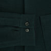 View 4 of product The Forest Green Greenwich Knitted Overshirt by Turnbull & Asser, crafted from Italian wool, features long sleeves, a collar, front buttons, and two chest pockets—one flap, one open—shown on a white background.