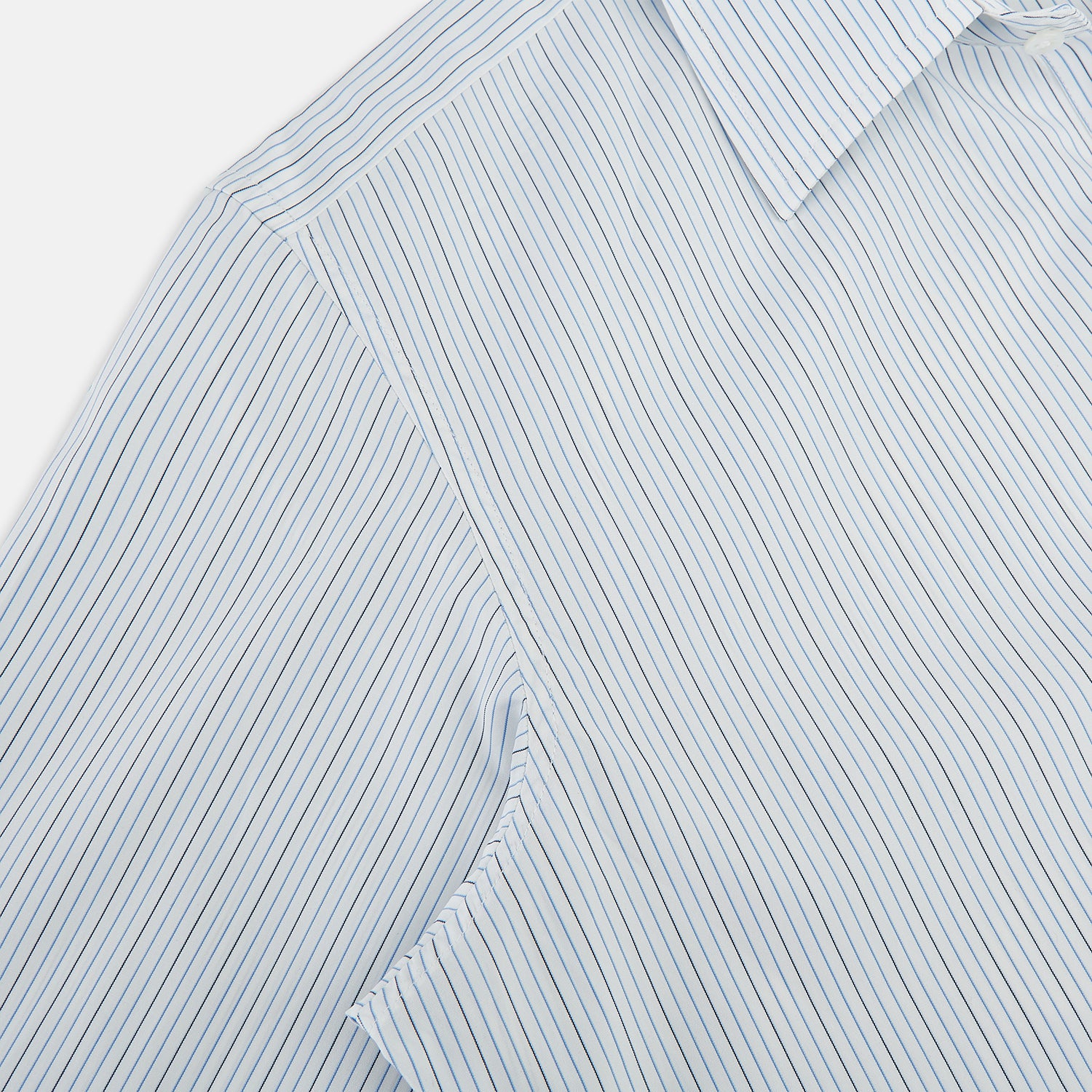 View 6 of product The Turnbull & Asser Pale Blue and Navy Pinstripe Westminster Shirt features long sleeves, a classic collar, and buttoned cuffs, highlighting British craftsmanship. The shirt is laid flat on a white background.