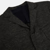 View 2 of product The Charcoal Linen Blend Cambridge blazer by Turnbull & Asser features British tailoring with a notched lapel, two front buttons, and three pockets, shown against a plain white background.