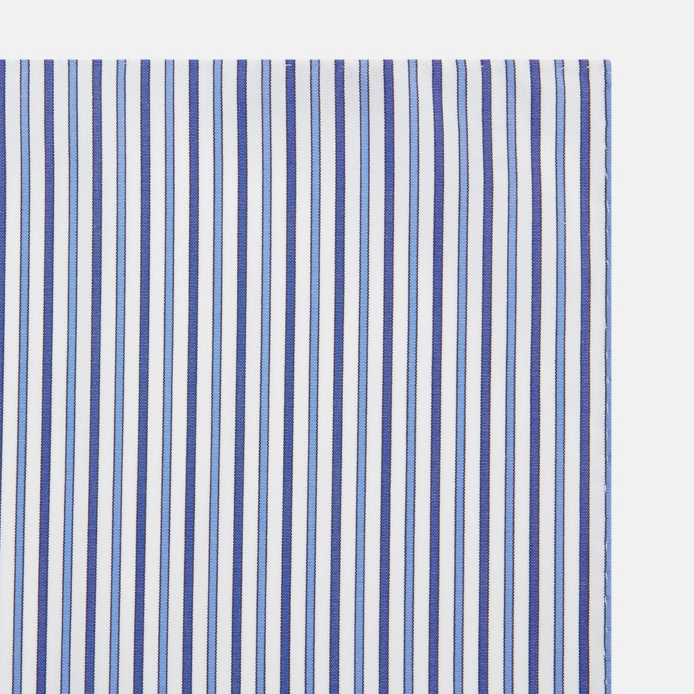 The Turnbull & Asser Navy and Blue Multi Stripe Handkerchief features a classic cotton pinstripe pattern—vertical blue and white stripes—making it a versatile and elegant formal accessory.