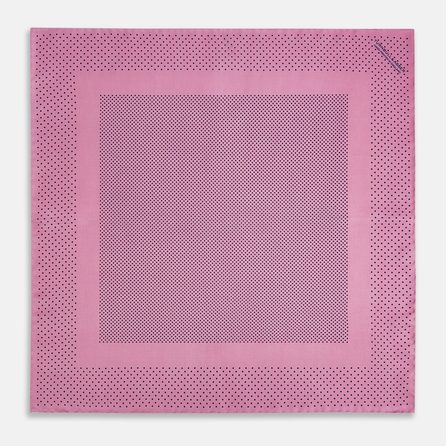 View 4 of product The Pink Dot Silk Pocket Square by Turnbull & Asser features pink silk with a border of small black dots, expertly handcrafted for a stylish touch to any suit. Fold to showcase both sides for added elegance.