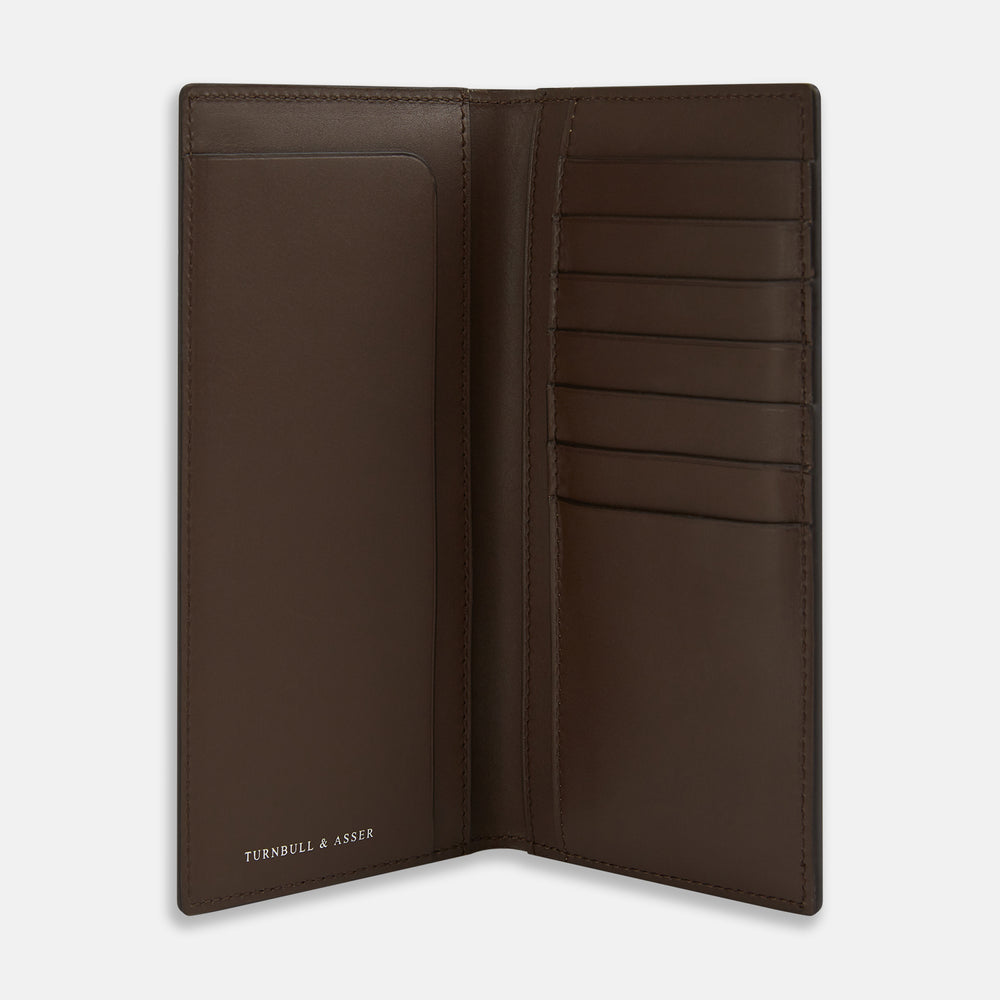 The Turnbull & Asser Dark Chocolate B Cut Continental Wallet features a simple rectangular design in rich brown Italian leather with clean edges and minimal stitching, shown closed on a plain white background.