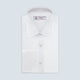 The Turnbull & Asser White Herringbone Sea Island Quality Cotton Shirt features a T&A collar, double cuffs, and chest pocket. Crafted for luxury with a classic design, it’s shown neatly folded against a light grey background—ideal for evening wear.