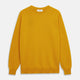 The Gold Glenn Cashmere Crew Neck Jumper by Turnbull & Asser is a luxurious, long-sleeved knit in vibrant mustard yellow, shown laid flat on a white background—an eye-catching essential.