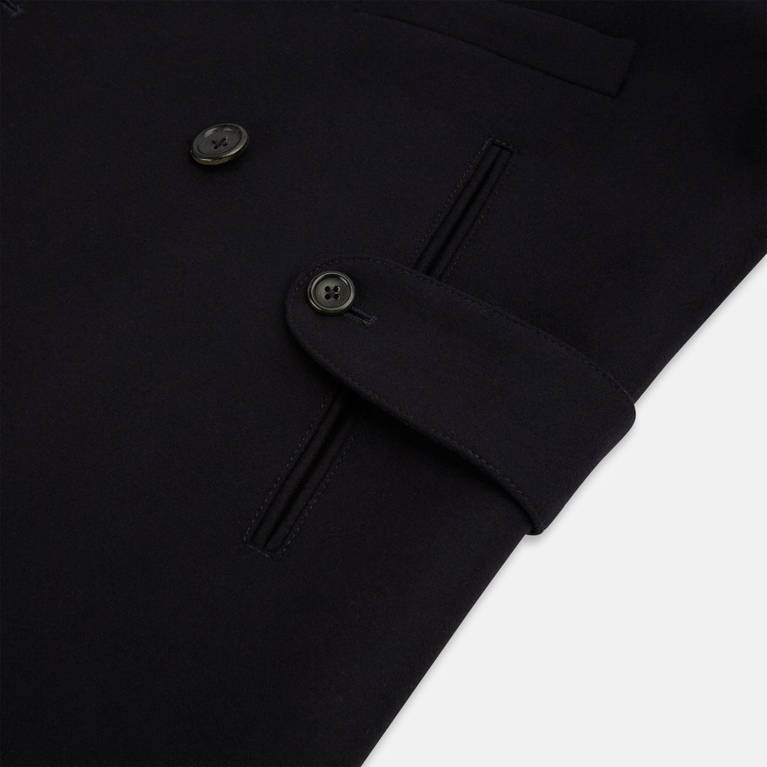 View 4 of product The Turnbull & Asser Navy Wellington Double-Breasted Caban Coat features wide lapels, six front buttons, a chest pocket, and two side pockets with buttoned flaps—ideal for polished formal wear.