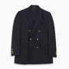 View 1 of product The Classic Navy Wool Blazer by Turnbull & Asser is a nautical double-breasted jacket with gold buttons, peaked lapels, three front pockets on one side, one on the other, and four gold buttons per cuff, shown against a white background.