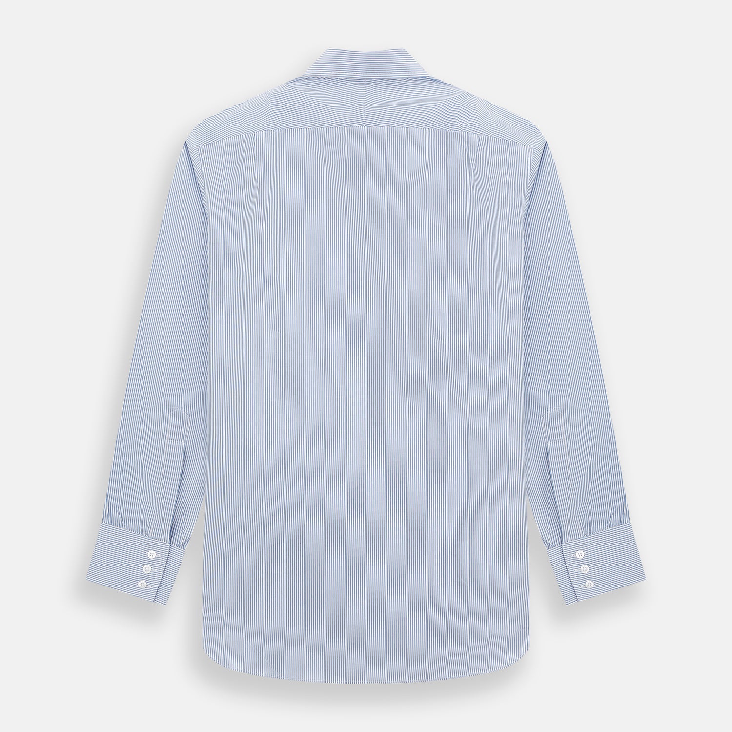 View 3 of product The Turnbull & Asser Pale Blue Pinstripe Mayfair Shirt features pale blue pinstripes, a classic T&A collar, white buttons, and cuffed sleeves, shown against a plain white background.