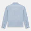 View 3 of product The Turnbull & Asser Pale Blue Hyde Overshirt is a long-sleeve, sanforised cotton button-up with a single chest pocket and dark buttons, shown on a plain white background.