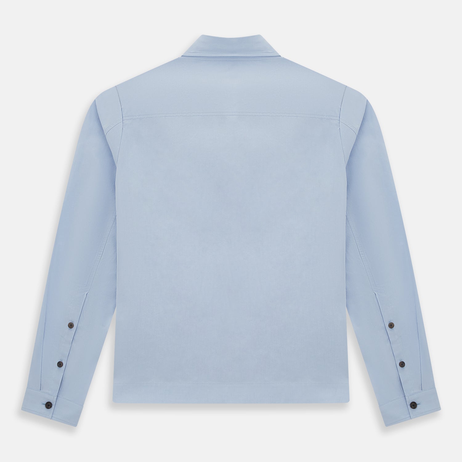 View 3 of product The Turnbull & Asser Pale Blue Hyde Overshirt is a long-sleeve, sanforised cotton button-up with a single chest pocket and dark buttons, shown on a plain white background.