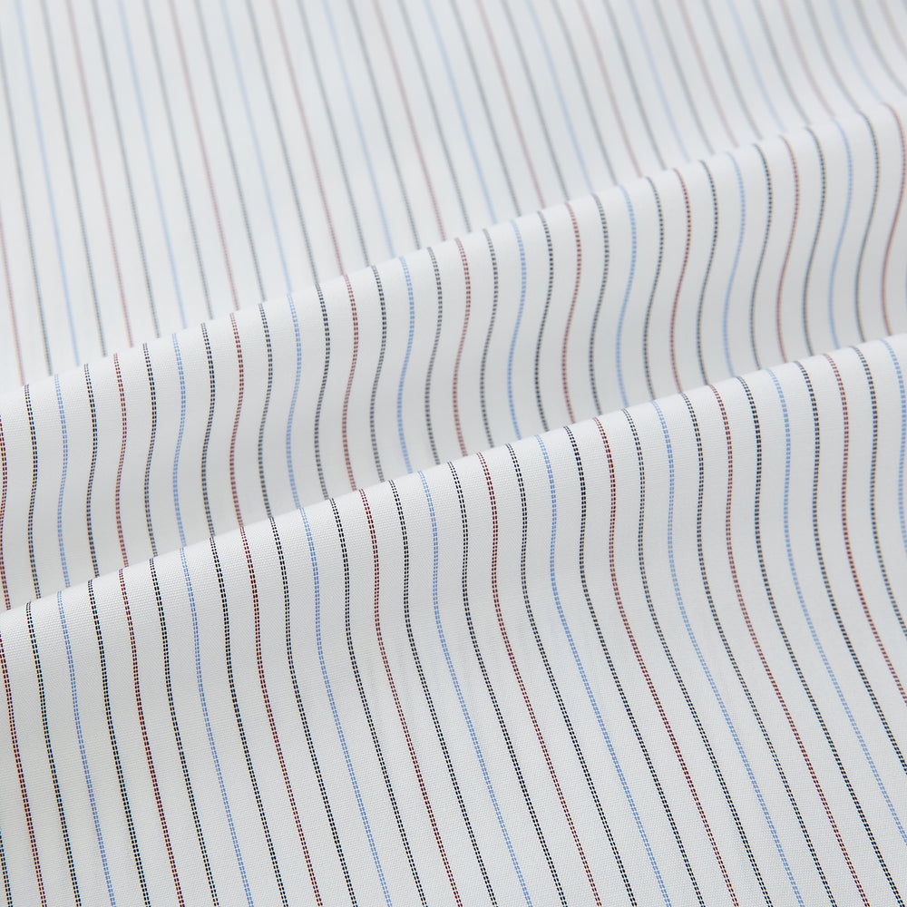 The Turnbull & Asser Red and Blue Double Pinstripe Mayfair Shirt features long sleeves, a collar, and button-up front, crafted from fine Italian cotton, displayed on a plain white background.