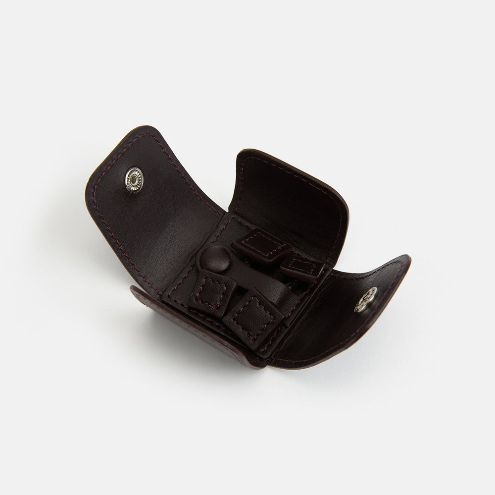 The Burgundy Leather Cufflinks by Turnbull & Asser feature square Italian leather with visible edge stitching and braided loops, presented on a white background—an elegant addition to men's accessories.