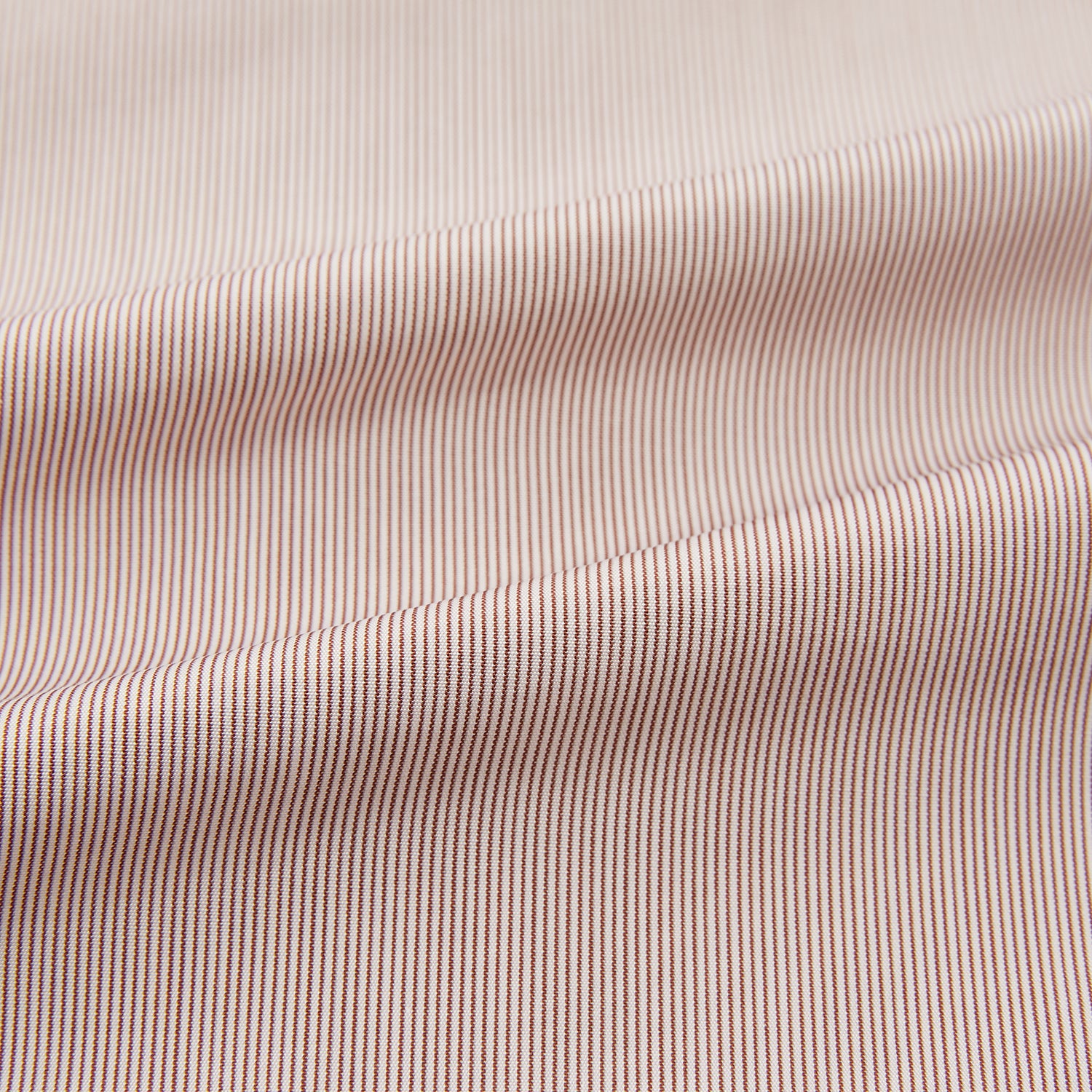 View 6 of product The Turnbull & Asser Burgundy Hairline Stripe Mayfair Shirt features long sleeves, a pointed collar, white buttons, and a classic Mayfair fit—perfect for formal occasions—presented against a plain white background.