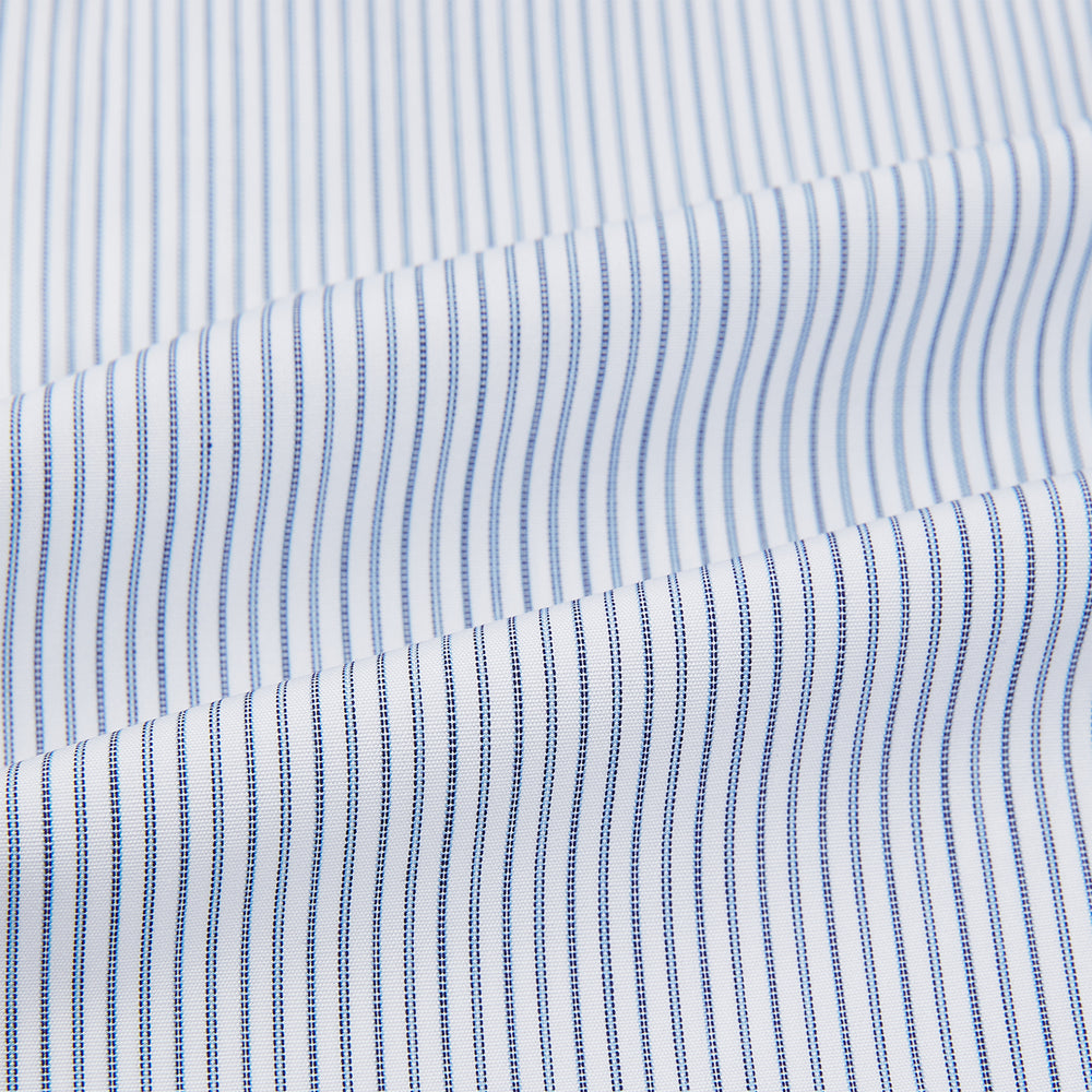 The Turnbull & Asser Navy and Blue Ticking Stripe Shirt features a contrast white collar and double cuffs, displayed on a plain white background. Tailored in the sleek Mayfair fit, it’s ideal for formal attire.