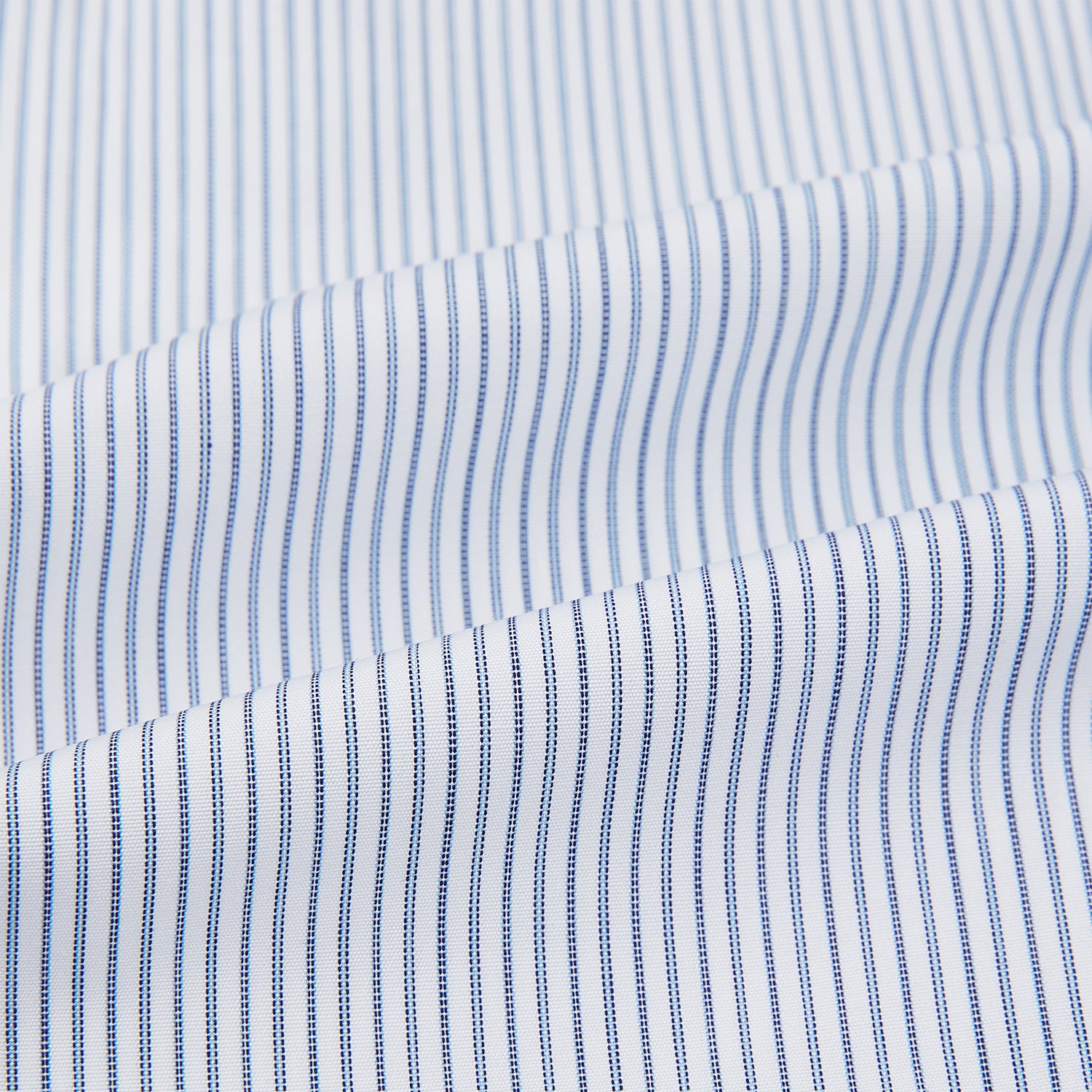 View 6 of product The Turnbull & Asser Navy and Blue Ticking Stripe Shirt features a contrast white collar and double cuffs, displayed on a plain white background. Tailored in the sleek Mayfair fit, it’s ideal for formal attire.