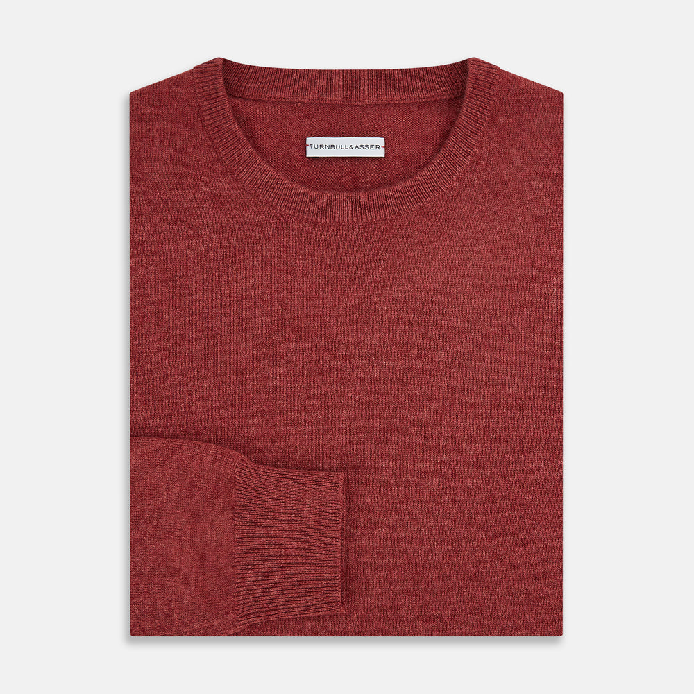 The Turnbull & Asser Crimson Red Cashmere Round Neck Jumper is a classic men’s knitwear piece, featuring long sleeves and a solid crimson hue, shown against a white background.