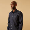 View 7 of product The Turnbull & Asser Blue Weekend Fit Finch Shirt features a Derby collar, chest pocket, classic white buttons, and timeless style, all in cotton. Laid flat on a white background.