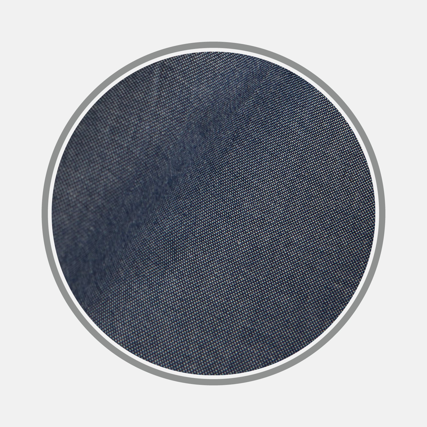 View 1 of product A close-up of Turnbull & Asser's Navy Oxford Cotton Fabric shows its finely woven, smooth texture with visible diagonal lines, displayed in a circular frame on a white background.