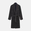 View 1 of product The Turnbull & Asser Charcoal Grey Check Wool Pierce Gown features a long, gown-style silhouette with a shawl collar, wrap-around belt, cuffed sleeves, and white edge stitching, shown against a plain white background.