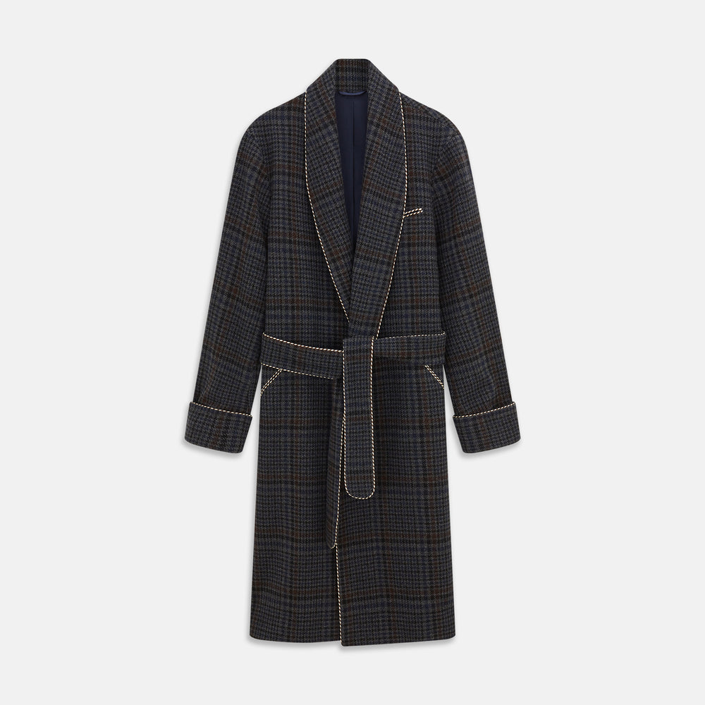The Turnbull & Asser Charcoal Grey Check Wool Pierce Gown features a long, gown-style silhouette with a shawl collar, wrap-around belt, cuffed sleeves, and white edge stitching, shown against a plain white background.