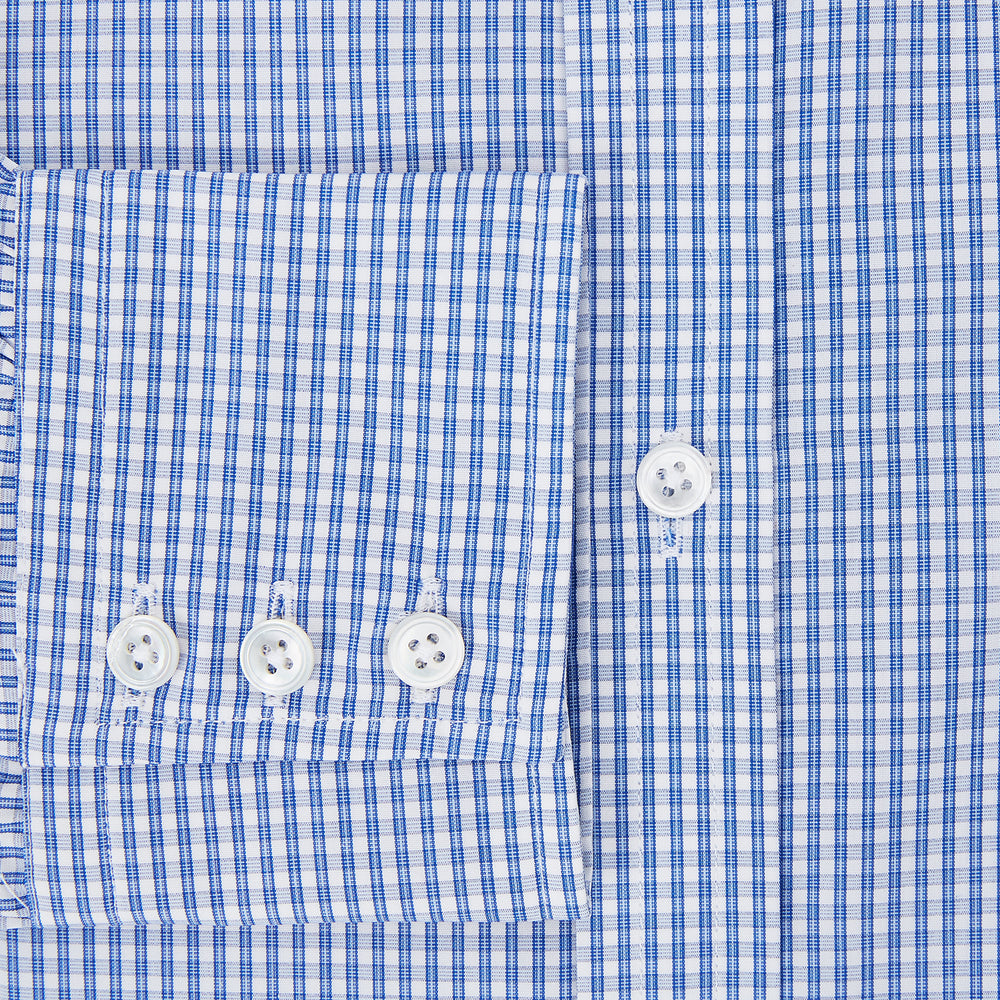 The Turnbull & Asser Blue Multi Micro Check Mayfair Shirt features a classic T&A collar, button-up front, white buttons, cuffed long sleeves, and a refined light blue and white micro check pattern.