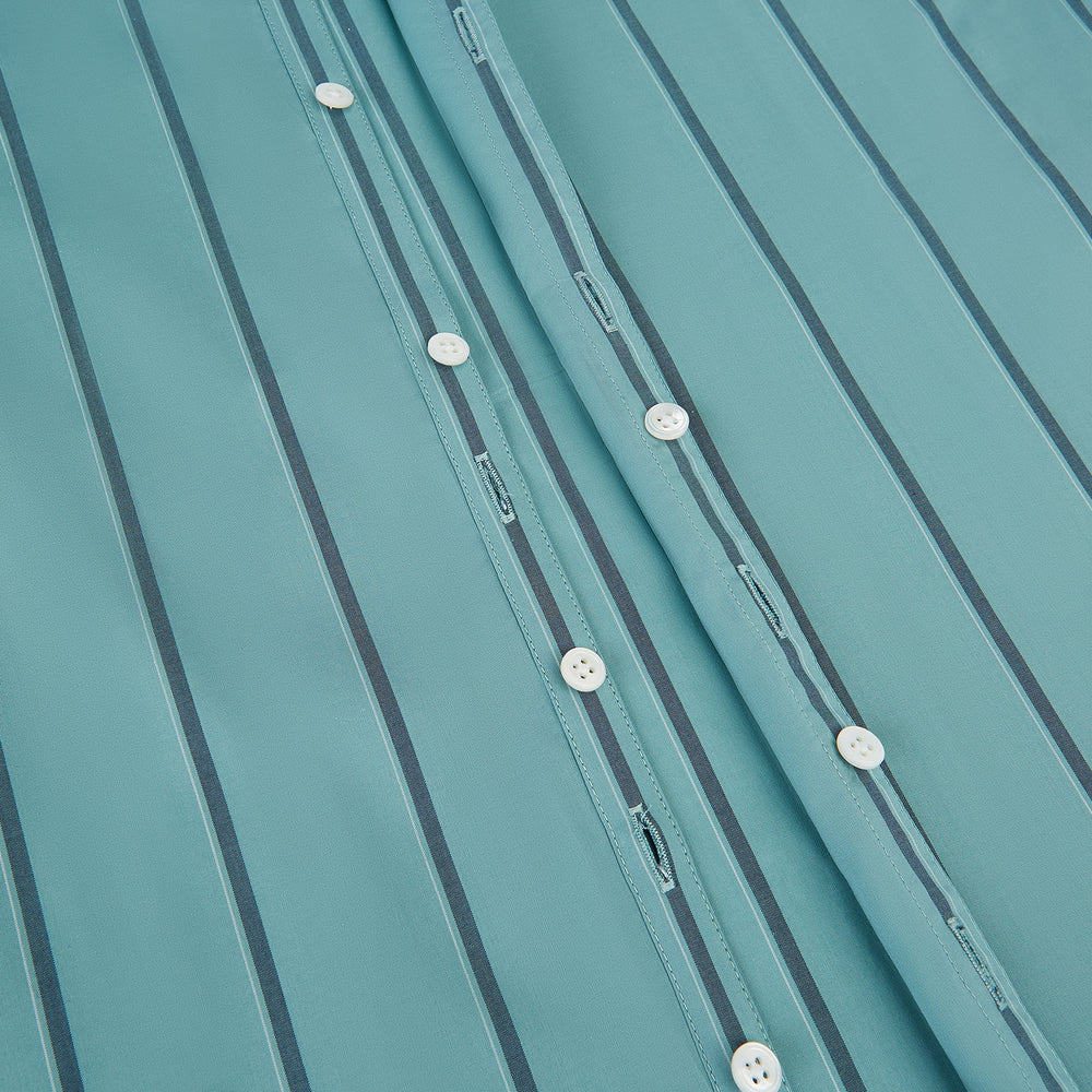 The Turnbull & Asser Sage Track Stripe Westminster Shirt features long sleeves, a tailored fit, a collar, and vertical dark blue stripes, with button closures down the front and at the cuffs, shown laid flat on a white background.