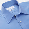 View 3 of product The Turnbull & Asser "The World Is Not Enough" blue cotton Istanbul shirt, as seen on James Bond, is a light blue oxford long-sleeve button-up with a pointed collar and white buttons, displayed on a white background.