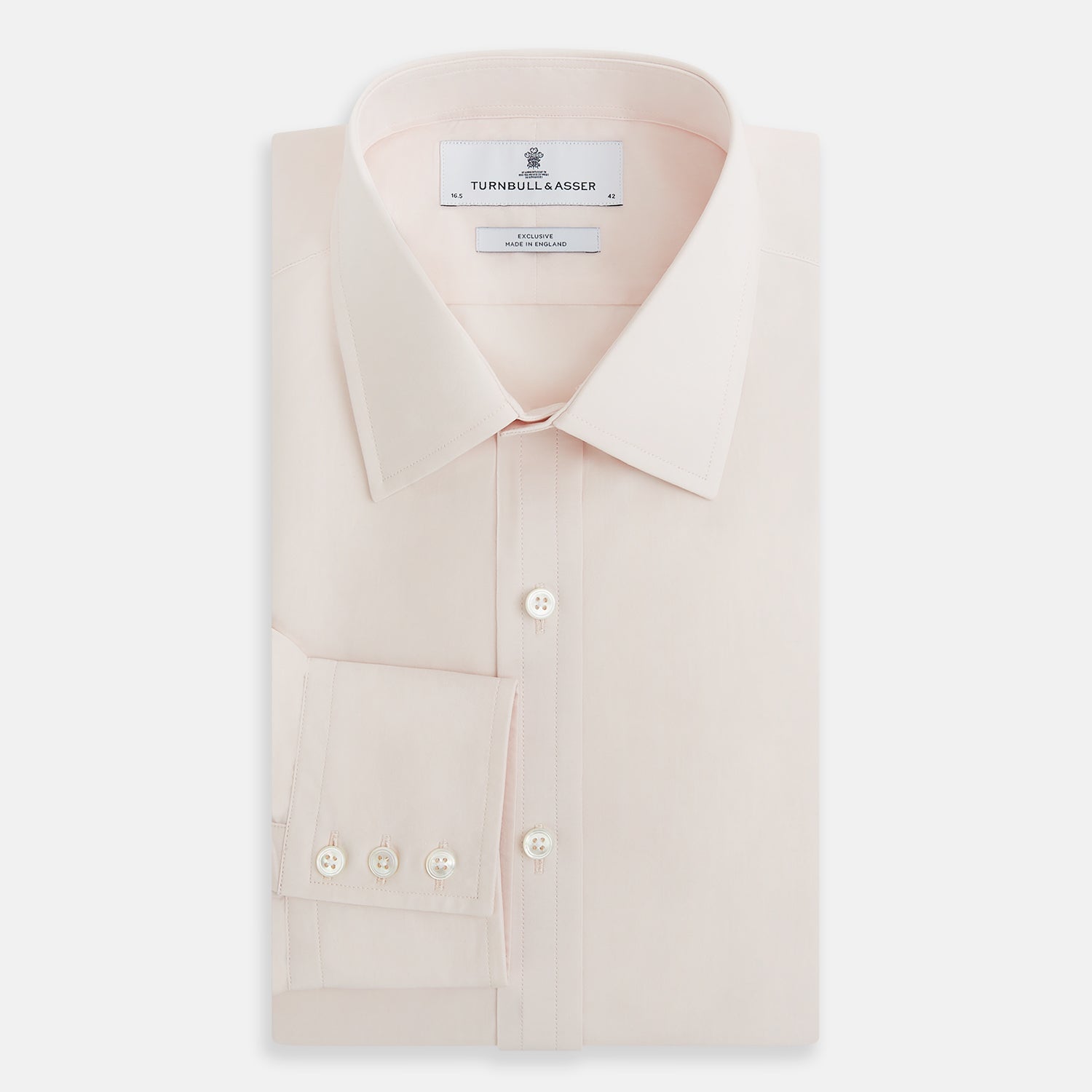 View 5 of product A plain, long-sleeve Pale Pink Mayfair Shirt by Turnbull & Asser with a T&A collar and buttoned cuffs, laid flat on a white background.