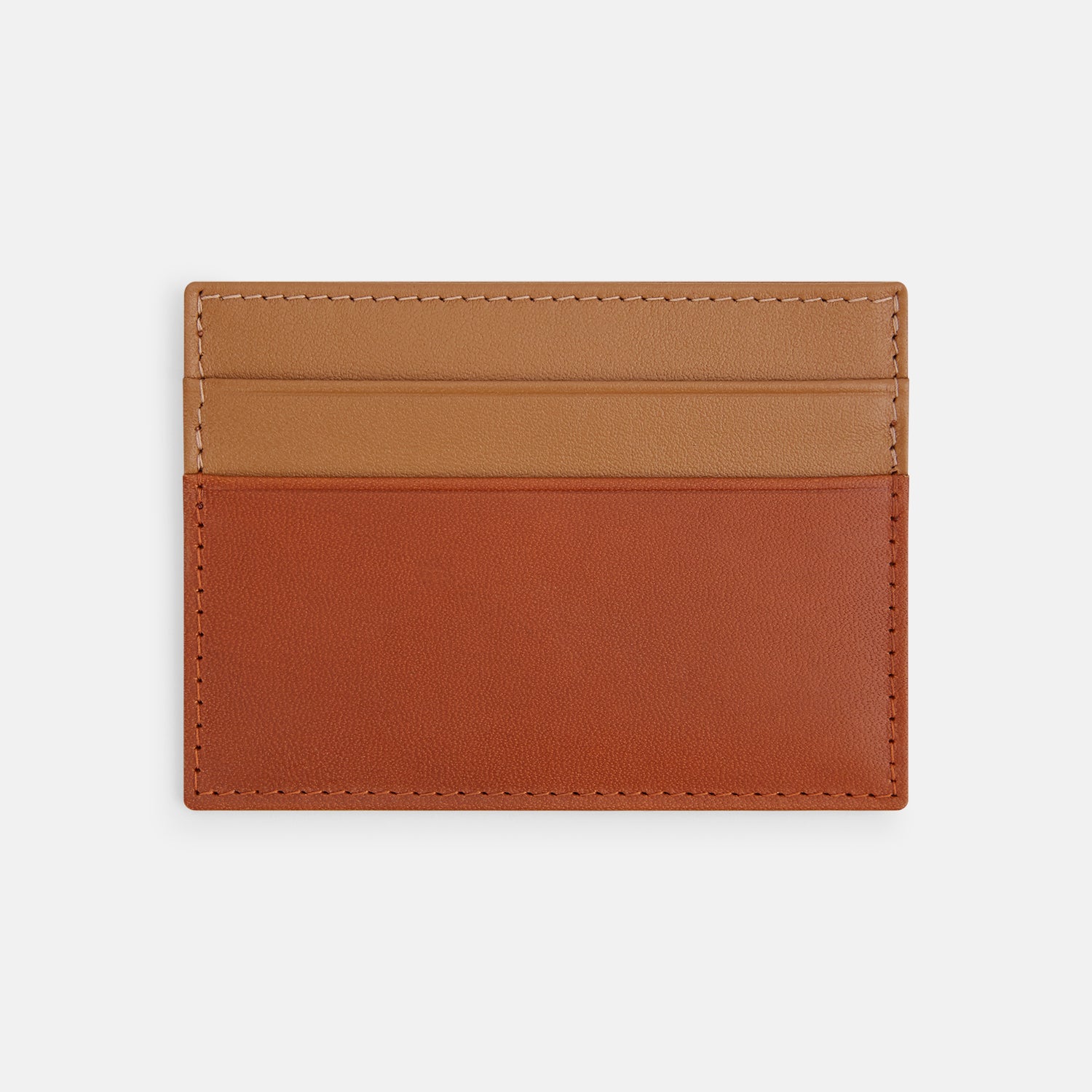 View 2 of product The TAN LEATHER CARD CASE by Turnbull & Asser is a minimalist brown leather wallet with two slots and "Turnbull & Asser Made in England" embossed on the front.