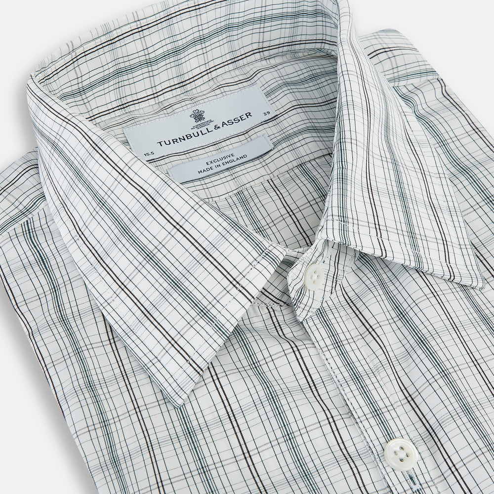 The Turnbull & Asser Forest Green Multi Check Westminster Shirt is a tailored, long-sleeved, button-up shirt with a collar and a white base featuring light blue and green plaid, displayed flat on a white background.