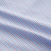 View 4 of product The Blue and Pink Stripe Poplin Cotton Nightshirt by Turnbull & Asser features long sleeves, a collar, front buttons, chest pocket, rounded hem, and light blue fabric with white, pink, and yellow vertical stripes.