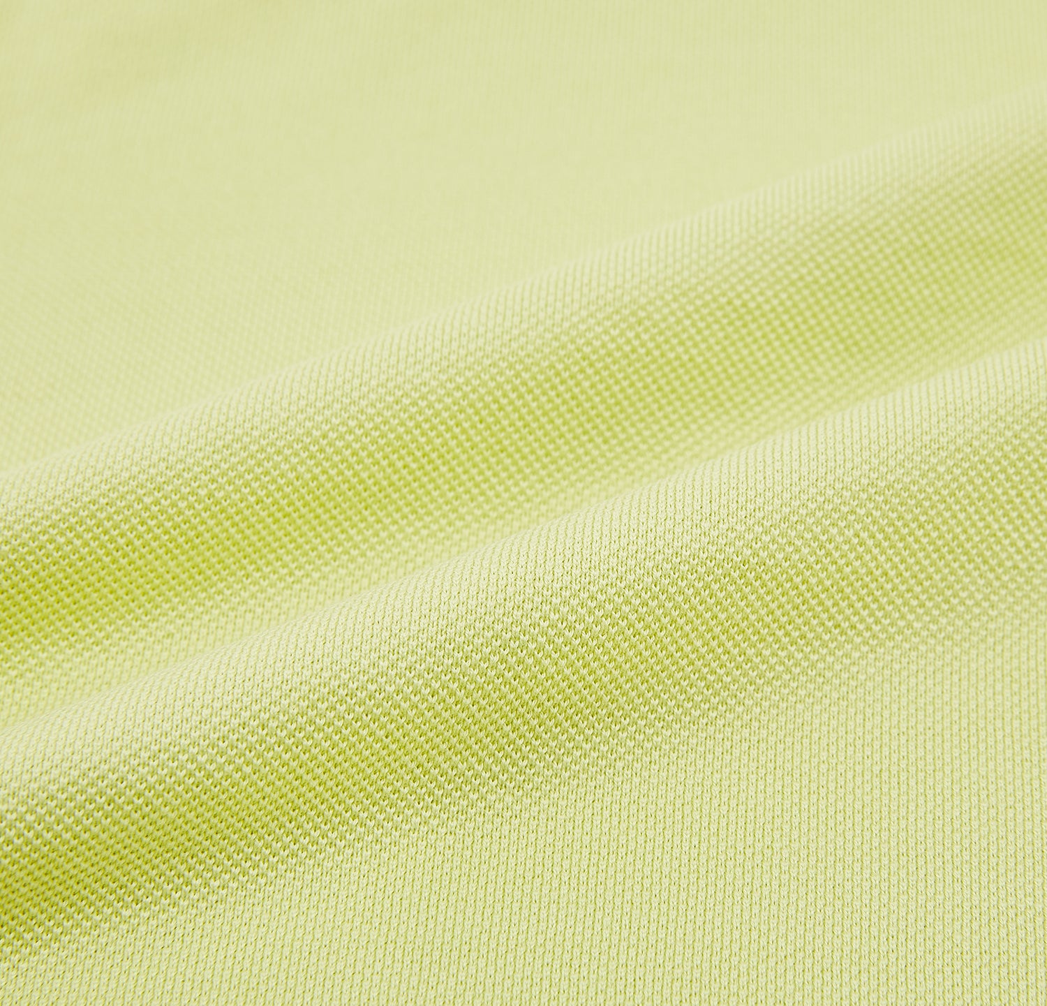 View 5 of product The Turnbull & Asser Lime Green Polo Shirt features a cotton jersey build, short sleeves, a collar, three brown buttons on the placket, and a chest pocket with a button. Shirt shown laid flat on a white background.
