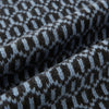 View 3 of product The Turnbull & Asser Dark Chocolate and Pale Blue Hexagon Cashmere Knitted Scarf is elegantly looped against a white background—an essential geometric accessory for any wardrobe.