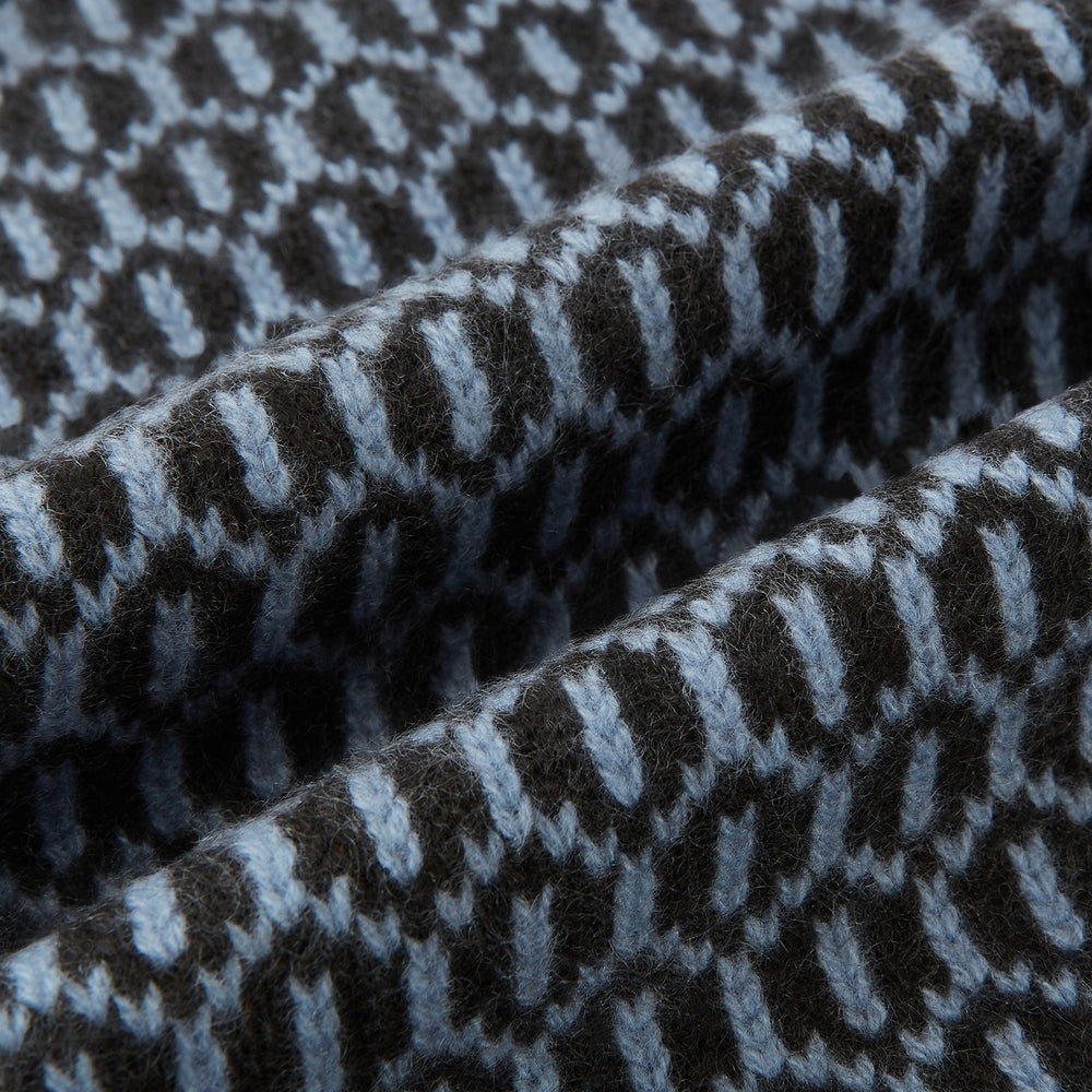 The Turnbull & Asser Dark Chocolate and Pale Blue Hexagon Cashmere Knitted Scarf is elegantly looped against a white background—an essential geometric accessory for any wardrobe.