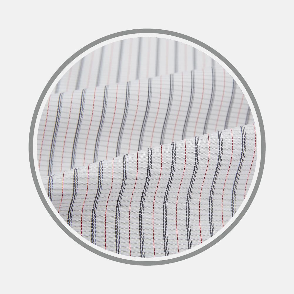 Close-up of Turnbull & Asser's Red and Navy Graph Check Fabric, featuring white material with fine red and navy vertical stripes, shown within a circular frame on a light gray background.