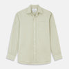 View 1 of product The Turnbull & Asser Soft Green Cashmerello Weekend Fit Finch Shirt features a Derby collar, long sleeves, chest pocket, white buttons, and cuffs. Laid flat on a white background.