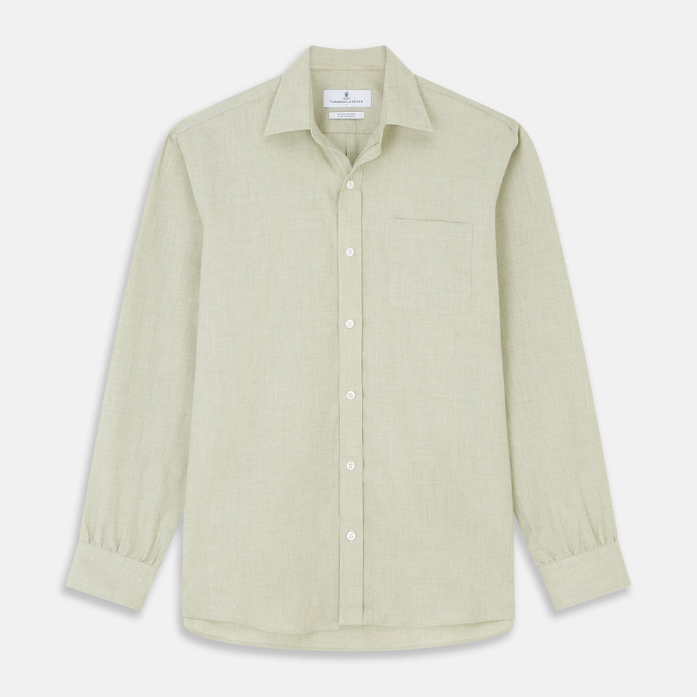 The Turnbull & Asser Soft Green Cashmerello Weekend Fit Finch Shirt features a Derby collar, long sleeves, chest pocket, white buttons, and cuffs. Laid flat on a white background.